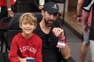 Michael Phelps with Boomer at the Los Angeles Rams vs. Arizona Cardinals game - Source: Getty